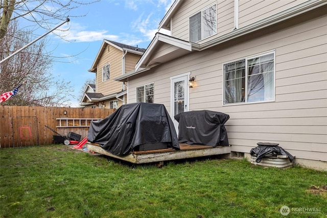 exterior space featuring a yard and fence