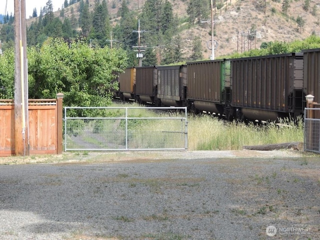 view of gate featuring fence