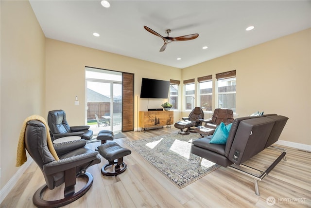 living area featuring ceiling fan, recessed lighting, baseboards, and light wood-style floors