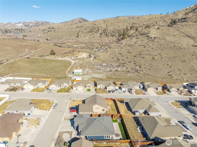 drone / aerial view with a residential view and a mountain view