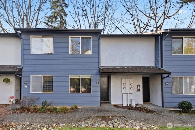 townhome / multi-family property with stucco siding