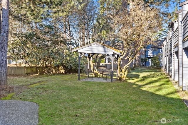 view of yard with a gazebo, a fenced backyard, and a patio