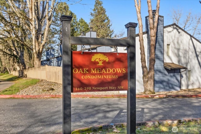 community sign with fence