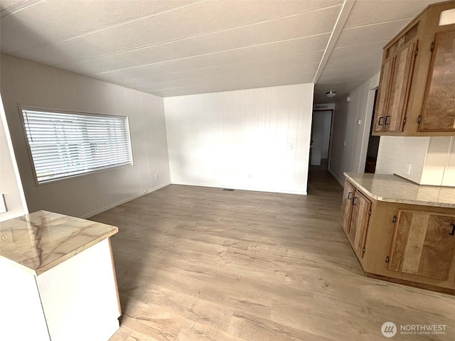 living room featuring light wood-style flooring and baseboards