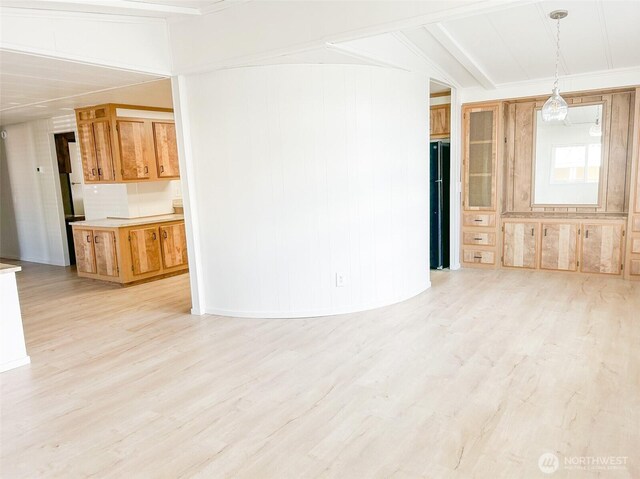 11436 SE 208th St Unit 106, Kent, WA 98031 - unfurnished living room with crown molding and light wood finished floors