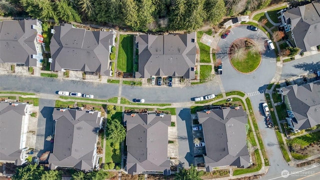 birds eye view of property with a residential view