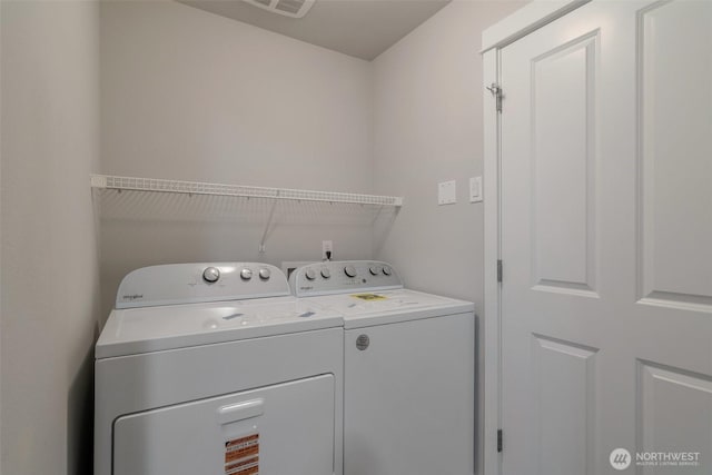 washroom with laundry area and separate washer and dryer