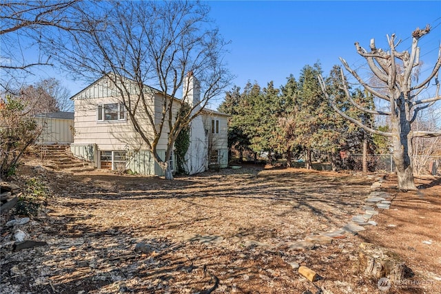 view of property exterior featuring a chimney