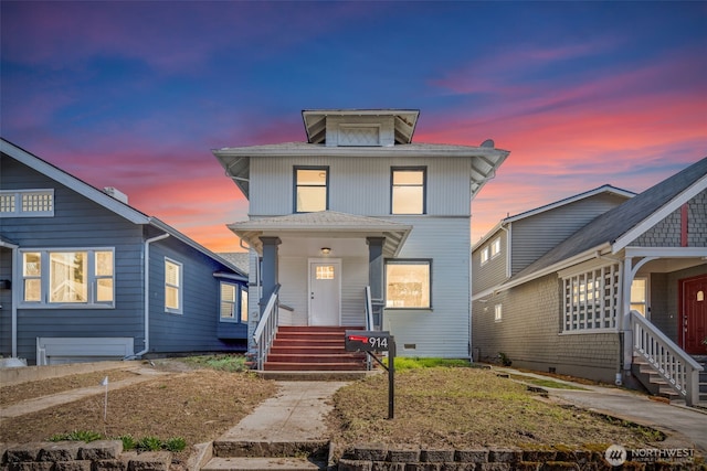 american foursquare style home with covered porch