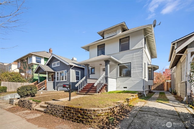 american foursquare style home featuring fence