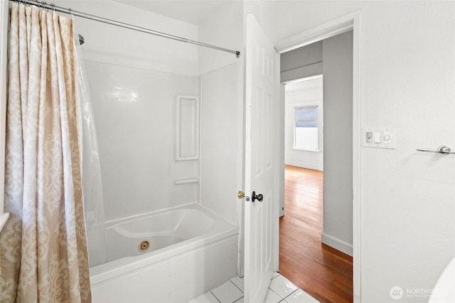 bathroom with shower / tub combo and tile patterned floors