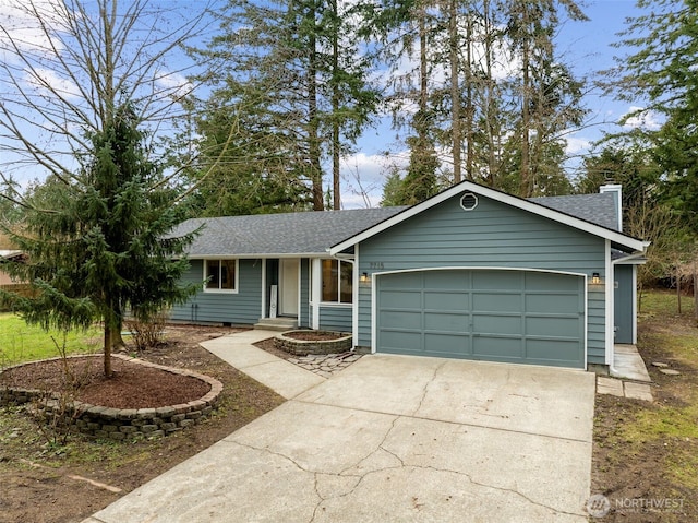 ranch-style home with concrete driveway, a garage, and roof with shingles