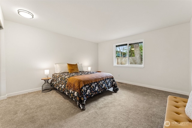 bedroom with baseboards and carpet floors