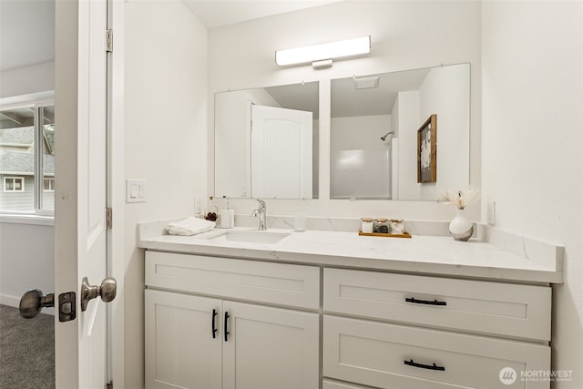 full bath featuring vanity and walk in shower