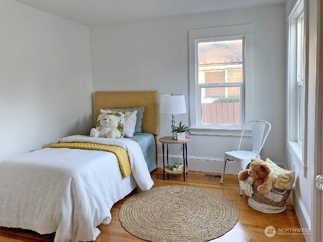 bedroom with wood finished floors