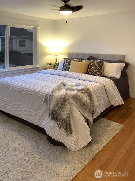 bedroom featuring wood finished floors and a ceiling fan