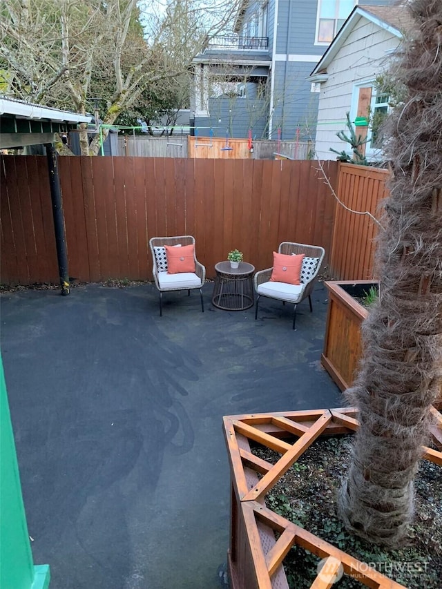 view of patio featuring fence