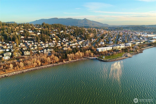 aerial view featuring a water and mountain view