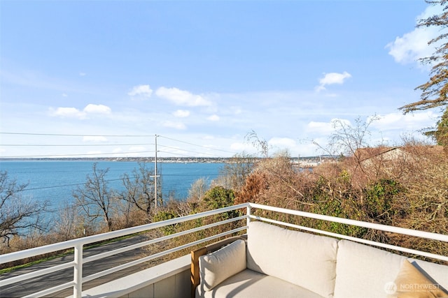 balcony featuring a water view