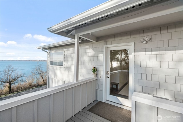 doorway to property featuring a water view