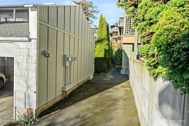 view of outbuilding with fence