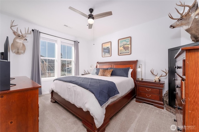 bedroom featuring carpet flooring, ceiling fan, and visible vents