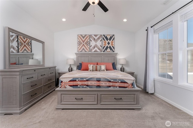 bedroom featuring lofted ceiling, ceiling fan, baseboards, and light colored carpet