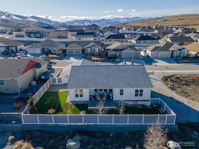 birds eye view of property with a residential view and a mountain view