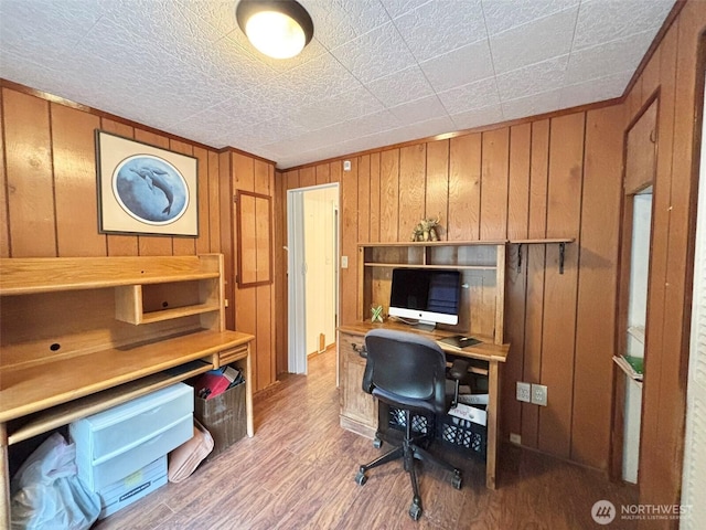 office featuring wood finished floors and wooden walls