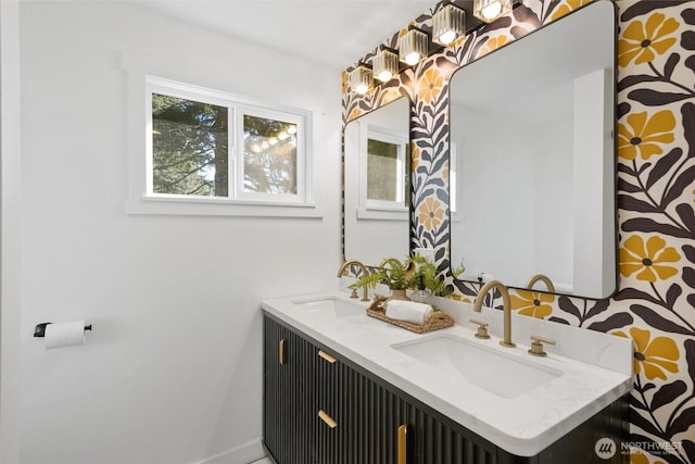 bathroom with double vanity and a sink