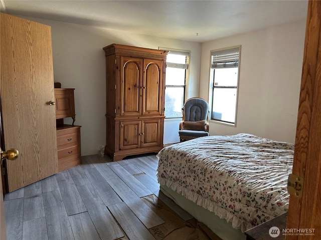 bedroom featuring wood finished floors