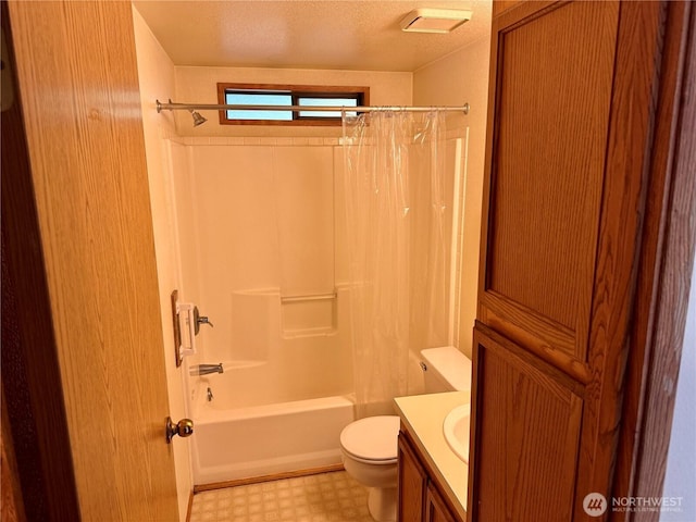 bathroom with a textured ceiling, toilet, vanity, tile patterned floors, and shower / bath combination with curtain