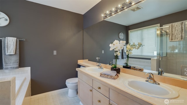 full bathroom with a garden tub, a stall shower, and a sink