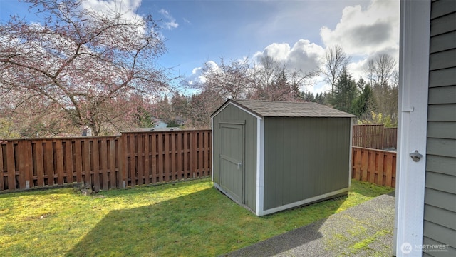 view of shed featuring a fenced backyard