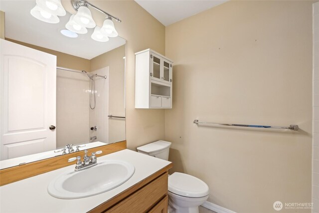 full bathroom with a shower, toilet, a chandelier, and vanity