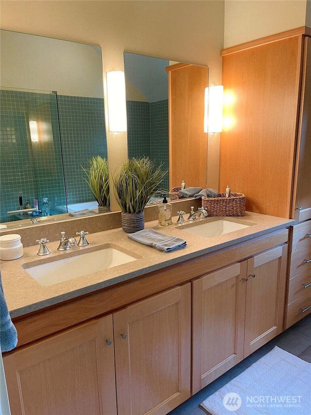 full bath featuring double vanity and a sink