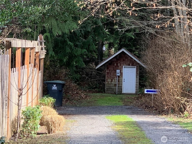 view of shed with fence