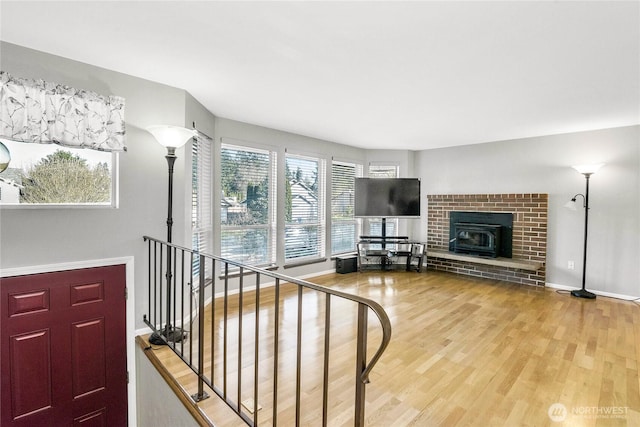 living room featuring baseboards and wood finished floors