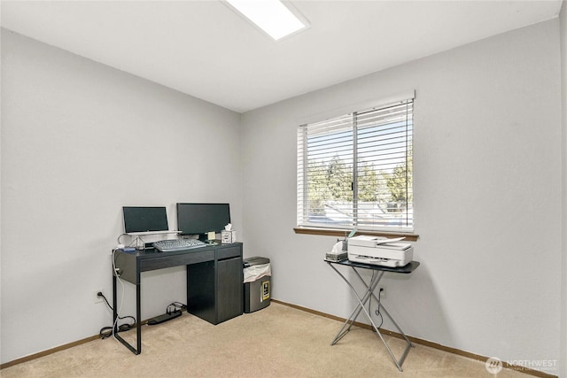 office with light carpet and baseboards