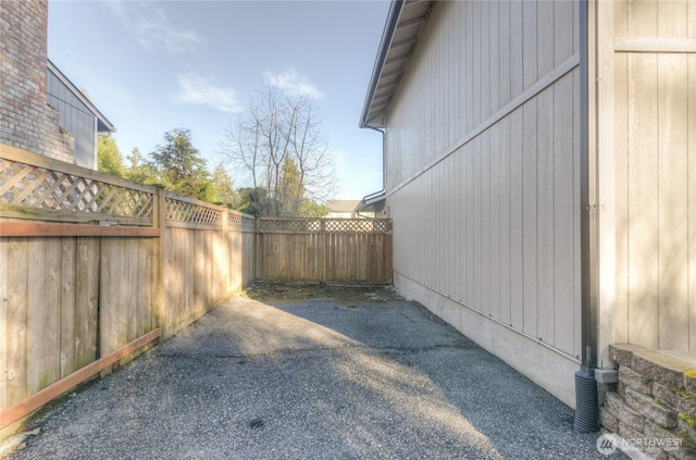 view of yard featuring fence and a patio