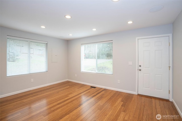 empty room with recessed lighting, visible vents, baseboards, and light wood-style flooring