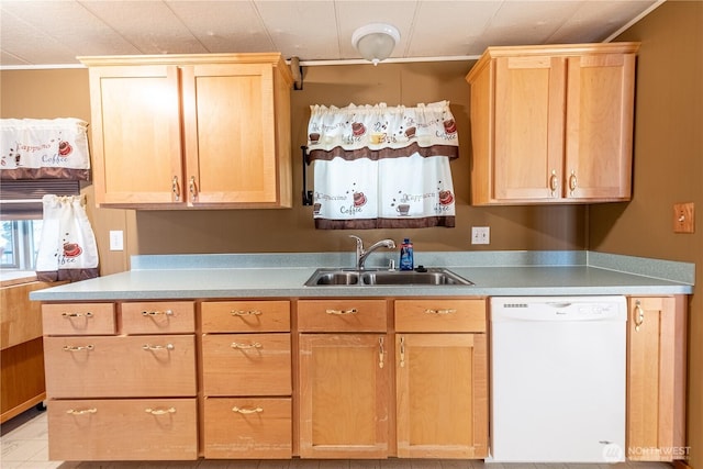 kitchen featuring a sink, light countertops, dishwasher, and light brown cabinetry