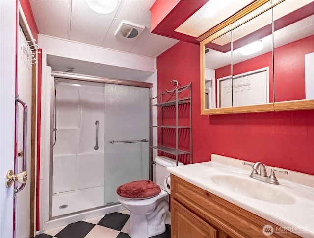 full bath with visible vents, a shower stall, vanity, and tile patterned floors