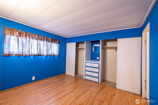 unfurnished bedroom featuring wood finished floors