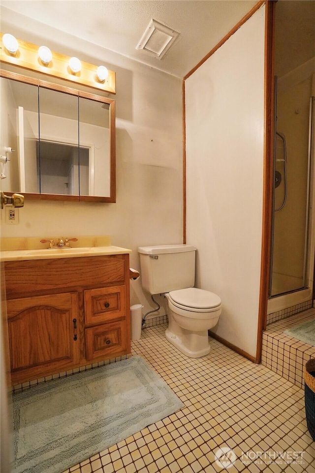 full bath featuring visible vents, a shower stall, toilet, and vanity