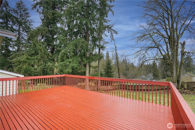 wooden deck with a yard