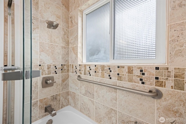 bathroom with washtub / shower combination