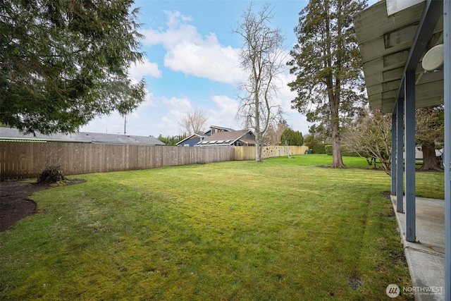 view of yard with a fenced backyard