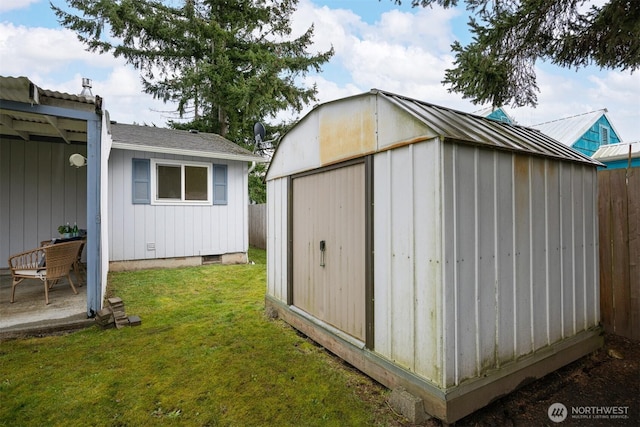 view of shed with fence