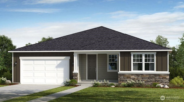 view of front facade with a garage, concrete driveway, roof with shingles, a front lawn, and board and batten siding